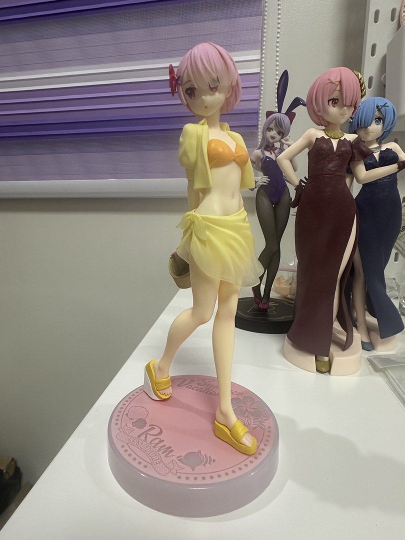 Ram Re:Zero Sun Vacation SSS Figure (Category: Figurines & Statues) located in Manila. Submitted by silentfire.54ea36 (Listing ID 1470115452, Image 1). Description: - Character: Ram from Re:Zero - Starting Life in Another World - Version: Sun Vacation by FuRyu - Outfit: Yellow bikini with matching open shirt and sarong - Base: Circular pink base featuring decorative text and shell graphics - Condition: Mint / Display-ready - Trusted seller with f