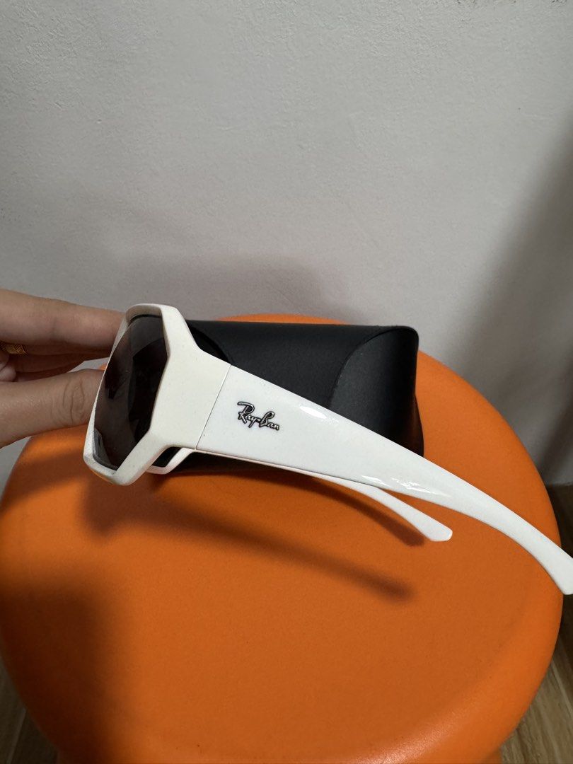 Ray-Ban RB4337 White Geometric Sunglasses (Category: Sunglasses & Eyewear) located in Valenzuela. Submitted by sofiasticated.decluttering (Listing ID 1470003300, Image 3). Description: - Brand: Ray-Ban - Model: RB 4337 (Color Code: 6491/87) - Frame: Bold white chunky geometric design - Lenses: Dark grey - Size: 59-21 125 3N - Details: Signature Ray-Ban logo on both temples and top corner of the left lens - Inclusion: Original black leatherette ha