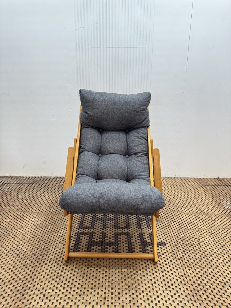 Recliner lounge chair (Category: Chairs) located in Quezon City. Submitted by matetdevis13 (Listing ID 1470121824, Image 1). Description: Modern Wooden Recliner Lounge Chair with Thick Padded Cushion Price: 3,900 L27.5 x W37 x H38/18 In good condition Code MJS18-R57 Japanese / Scandinavian-inspired Natural wood frame with dark gray fabric. It has a High backrest, thick tufted cushioning, wooden armrests, and reclining-style frame..