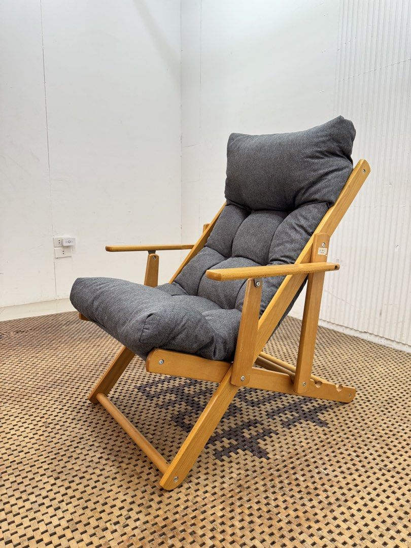 Recliner lounge chair (Category: Chairs) located in Quezon City. Submitted by matetdevis13 (Listing ID 1470121824, Image 2). Description: Modern Wooden Recliner Lounge Chair with Thick Padded Cushion Price: 3,900 L27.5 x W37 x H38/18 In good condition Code MJS18-R57 Japanese / Scandinavian-inspired Natural wood frame with dark gray fabric. It has a High backrest, thick tufted cushioning, wooden armrests, and reclining-style frame..