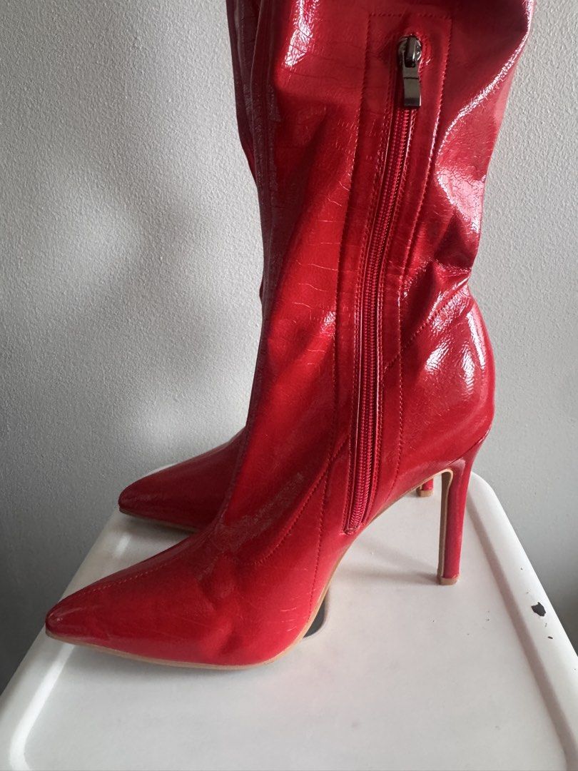 Red Patent Leather Pointed Toe High Heel Boots (Category: Boots) located in Manila. Submitted by bellebeauty.2002 (Listing ID 1469992652, Image 3). Description: - Color: Bright red - Material: Glossy patent leather with subtle croc-embossed texture - Design: Tall boots with pointed toe and slender high heel - Closure: Convenient side zipper - Condition: Clean soles, crisp structure throughout - Perfect for: Nights out, parties, and making a bold 