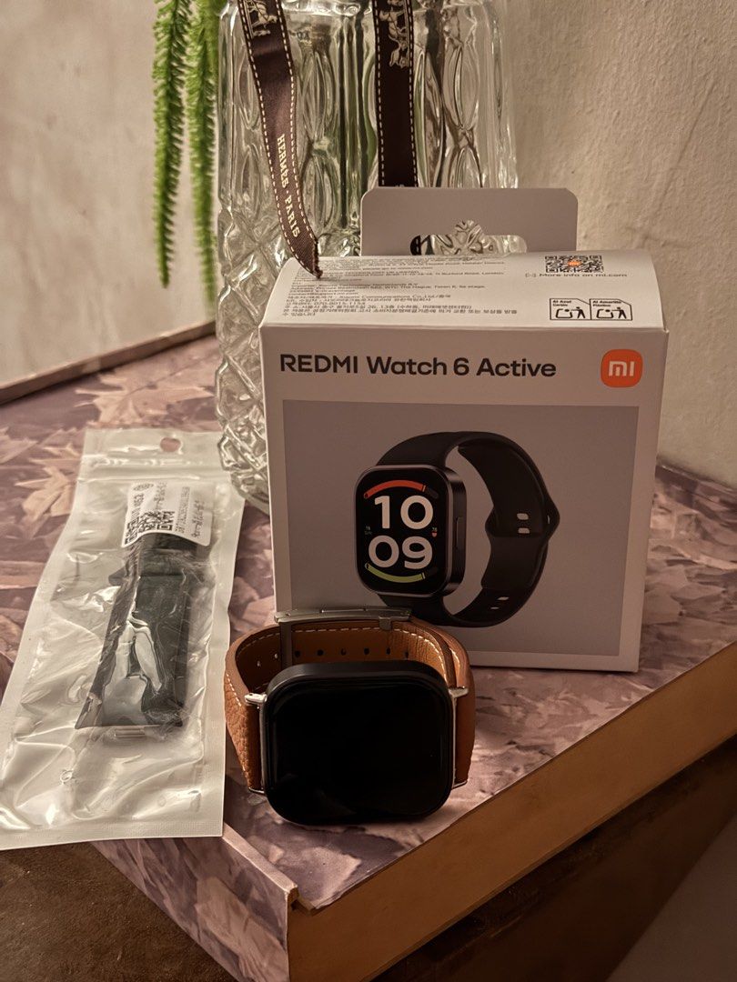 Redmi Watch 6 Active (Category: Wearables & Smart Watches) located in Manila. Submitted by justhazel (Listing ID 1470089974, Image 1). Description: - Brand/Model: Redmi Watch 6 Active - Condition: Excellent / Like New (Layered condition 4) - Inclusions: Original box, premium brown leather strap installed, plus extra black strap in sealed pouch - Design/Features: Sleek square display, customizable watch faces (includes classic Roman numeral style)
