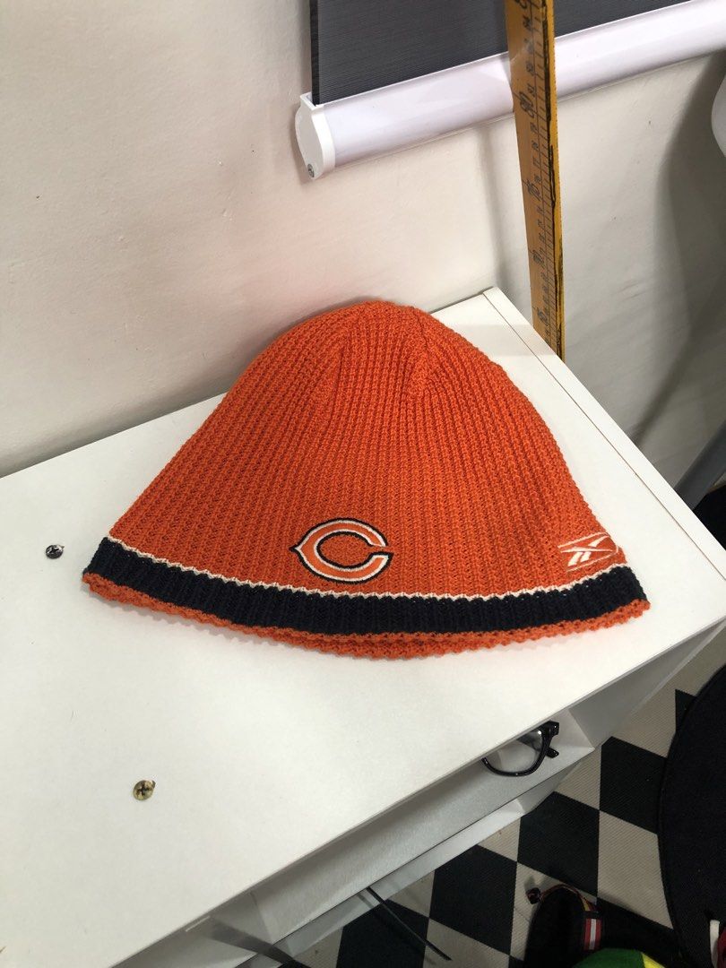 Reebok NFL Chicago Bears Reversible Beanie (Category: Beanies) located in Manila. Submitted by ejaay_2012 (Listing ID 1470104349, Image 3). Description: - Official Reebok Chicago Bears reversible winter beanie - 2-in-1 design: Navy body with orange brim on side one, orange body with navy brim when flipped - Classic Chicago Bears 'C' logo on the front - NFL shield patch and Reebok vector logo detailing - Thick, warm knit material ideal for cold we