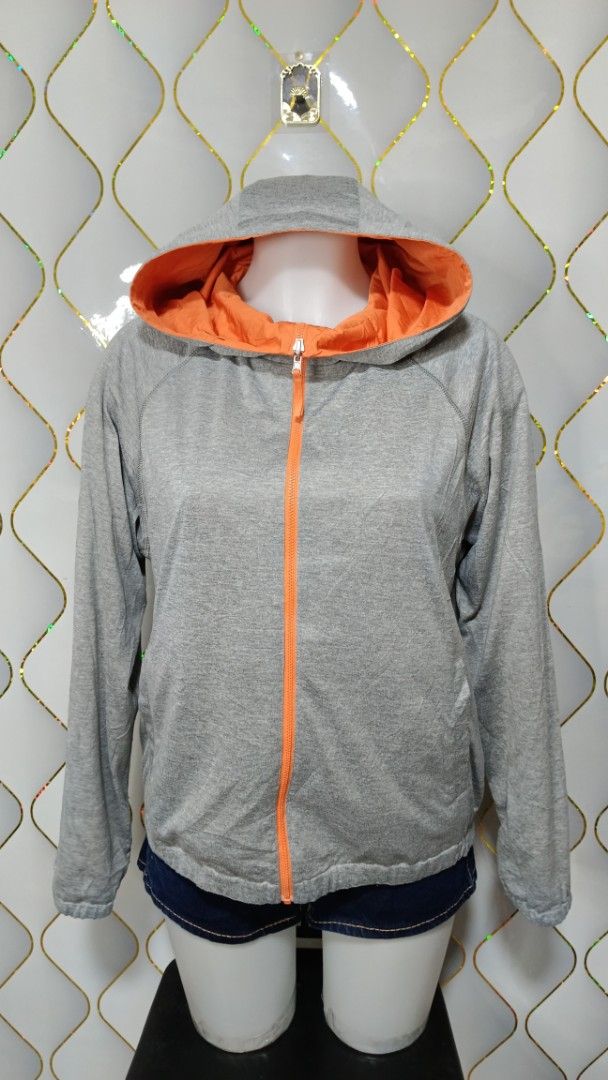 Reversible Hooded Jacket Orange and Grey (Category: Coats, Jackets and Outerwear) located in Manila. Submitted by zariyah.1986 (Listing ID 1470068853, Image 2). Description: - Style: 2-in-1 Reversible Hooded Jacket - Colors: Bright Orange (side 1) / Grey Jersey Fabric (side 2) - Closure: Full zip with matching orange zipper tape - Pockets: Functional side pockets on both reversible sides - Comfort & Fit: Attached hood, long sleeves, with elastici