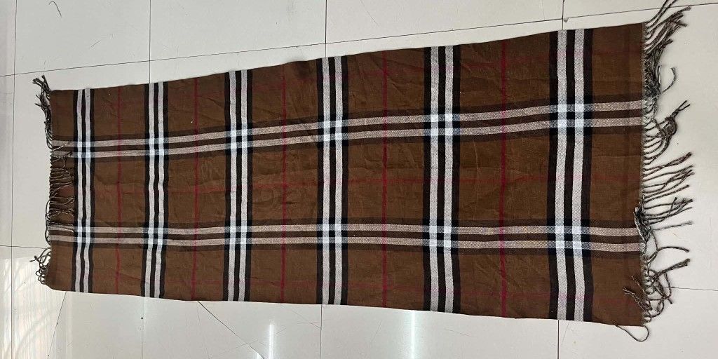Reversible Patterned and Plaid Scarves (Category: Scarves) located in Bacolod City. Submitted by rimboythrift (Listing ID 1470030333, Image 2). Description: - 2-in-1 Bundle: Includes two distinct scarves for versatile styling - Reversible/Dual Design: One scarf features an edgy knight graphic with black borders; the other showcases a classic brown plaid pattern with red, white, and black stripes - Cozy & Soft: Crafted from soft fabric to keep you