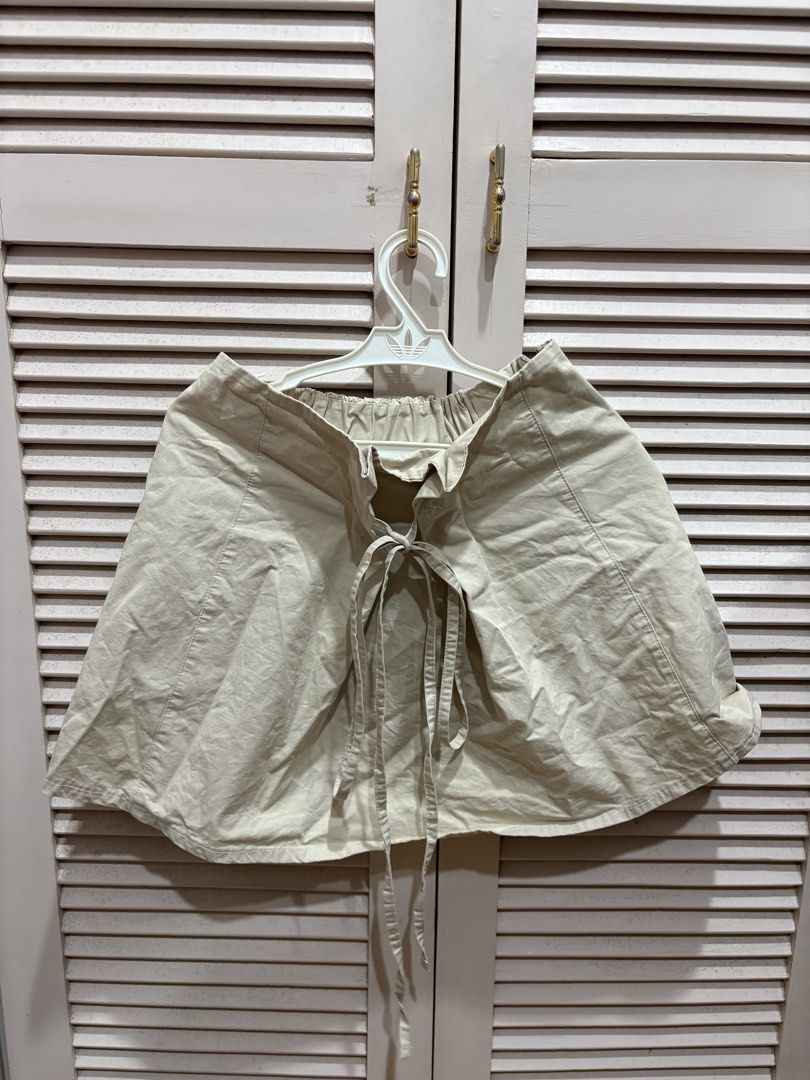 Reworked Beige Mini Skirt (Category: Skirts) located in Muntinlupa City. Submitted by sukimum (Listing ID 1469975237, Image 1). Description: Bought this item on IG as part of a set. Used once only, would wear more if it fit me better. It fits petite girls best (XS-S). The gartered back and front tie are suuuper cute even with just a white shirt. Great for summer and easy to layer!.