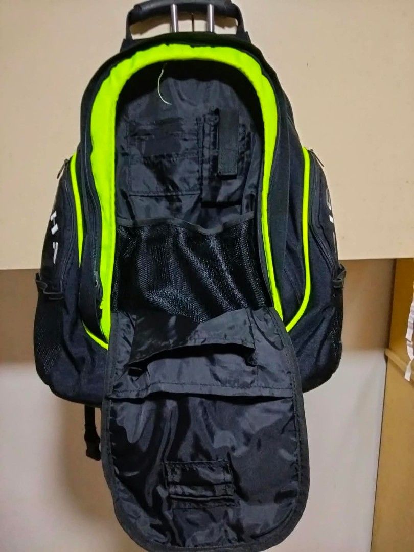 Richa Black and Neon Green Backpack (Category: Backpacks) located in Mangaldan. Submitted by niftythrifty69 (Listing ID 1470053654, Image 3). Description: - Brand: Richa - Color: Black with bright neon green panels and reflective silver strip - Storage: Good capacity with multiple internal compartments and organizer slots - Pockets: Convenient mesh side pockets - Comfort: Adjustable shoulder straps and sturdy top handle - Ideal for: Daily commute