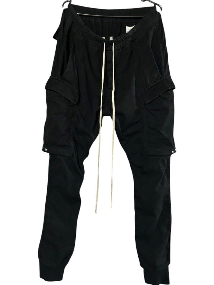 Rick Owens MAINLINE S/S19BABEL Cargo Jogger Pants (Category: Joggers) located in Cagayan de Oro. Submitted by oracle_archives (Listing ID 1470118076, Image 1). Description: Rick Owens MAINLINE SS19 “BABEL” Cargo Jogger Pants Authentic W:30”-36” L:40” Rise:12” Inseam:28” Thigh:11” Knee:7.5” Leg opening:4.5”.