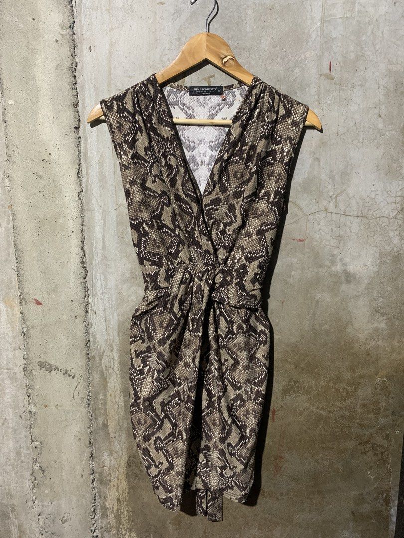 Rinascimento snake skin (Category: Dresses) located in Manila. Submitted by zthriftyyy (Listing ID 1470047148, Image 1). Description: Rinascimento Snake Print Self-Tie Dress | Size S Authentic Rinascimento from Italy 🇮🇹 Perfect for night out, date, or elegant events. DETAILS: • Size: S on tag | Best fits S-M Women’s • Color: Taupe/Brown Snake Print • Cut: Deep V, Draped front, Self-tie waist, Midi length • Material: Soft, comfy, and flowy • Sty