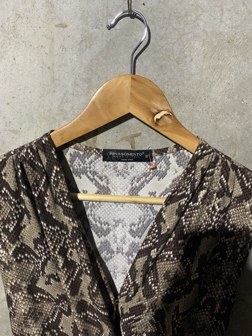 Rinascimento snake skin (Category: Dresses) located in Manila. Submitted by zthriftyyy (Listing ID 1470047148, Image 3). Description: Rinascimento Snake Print Self-Tie Dress | Size S Authentic Rinascimento from Italy 🇮🇹 Perfect for night out, date, or elegant events. DETAILS: • Size: S on tag | Best fits S-M Women’s • Color: Taupe/Brown Snake Print • Cut: Deep V, Draped front, Self-tie waist, Midi length • Material: Soft, comfy, and flowy • Sty