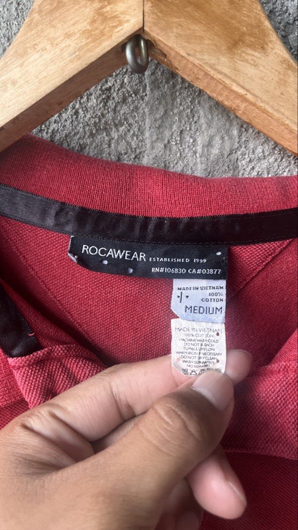 Rocawear Red Polo Shirt Size Medium (Category: Tshirts & Polo Shirts ) located in Cabuyao City. Submitted by bulandos (Listing ID 1470033169, Image 3). Description: - Brand: Rocawear (Est. 1999) - Size: Medium - Material: 100% Cotton - Origin: Made in Vietnam - Details: Textured pique fabric, embroidered R logo on chest and back collar, classic collar with single-button placket.