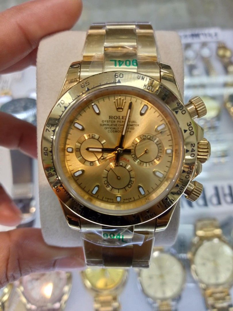 Rolex Cosmograph Daytona Gold Green Dial (Category: Luxury Watches) located in Las Pinas. Submitted by teampeewee888 (Listing ID 1470016439, Image 3). Description: - Model: Rolex Daytona Chronograph - Dial: Green with gold subdials and baton markers - Bezel: Polished gold tachymeter bezel - Bracelet: Oyster bracelet (still with protective plastic film) Japan made Premium - Movement: Automatic - Features: Crown guards and screw-down pushers - Cond