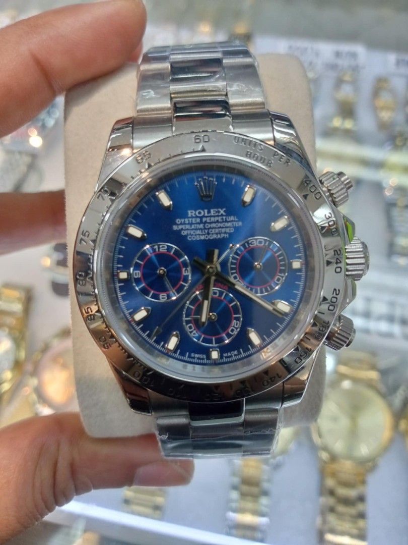 Rolex Cosmograph Daytona Gold Green Dial (Category: Luxury Watches) located in Las Pinas. Submitted by teampeewee888 (Listing ID 1470016439, Image 1). Description: - Model: Rolex Daytona Chronograph - Dial: Green with gold subdials and baton markers - Bezel: Polished gold tachymeter bezel - Bracelet: Oyster bracelet (still with protective plastic film) Japan made Premium - Movement: Automatic - Features: Crown guards and screw-down pushers - Cond