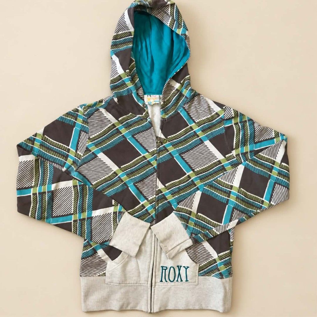 Roxy Plaid Zip Up Hoodie Teal Brown (Category: Coats, Jackets and Outerwear) located in Manila. Submitted by joshbelgic17602 (Listing ID 1469970753, Image 1). Description: - Brand: Roxy - Style: Zip-up hoodie, skater/surf casual wear - Pattern: Colorful plaid check (dark brown, teal blue, white, green) - Details: Teal blue hood lining, light grey ribbed cuffs, hem, and front pockets - Branding: Roxy embroidered in teal on the left pocket - Materi