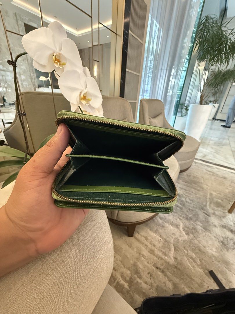 Rudolp Valentino Green Wallet (Category: Luxury Bags & Wallets) located in Quezon City. Submitted by Cristian (Listing ID 1470054262, Image 3). Description: Rudolph Valentino ( Vintage wallet) • Color: Vibrant Emerald Green • Material: Premium textured Saffiano leather (highly durable and scratch-resistant) • Hardware: Polished gold-tone front plaque featuring the iconic split “V” logo and cursive brand engraving. • Closure: Secure, smooth wrap-a