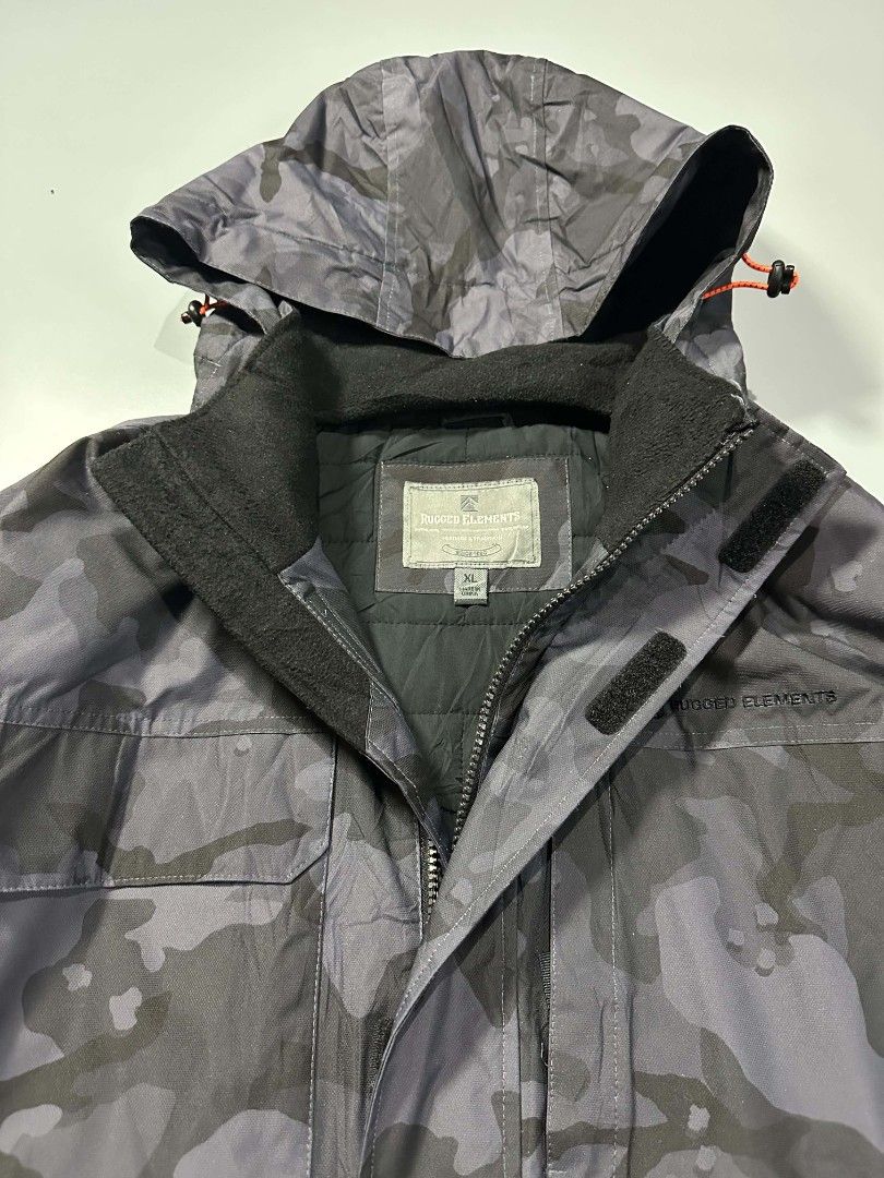 Rugged Elements Camouflage Hooded Winter Jacket XL (Category: Coats, Jackets and Outerwear) located in Manila. Submitted by whoego (Listing ID 1470123416, Image 2). Description: - Brand: Rugged Elements Dimes: Length: 29 inches Width: 26 inches Shoulders: 20.5 inches Sleeves: 26.5 inches - Style: Winter jacket in grey camouflage pattern - Size: XL - Warmth: Quilted inner lining for extra cold protection - Hood: Attached hood with adjustable draws