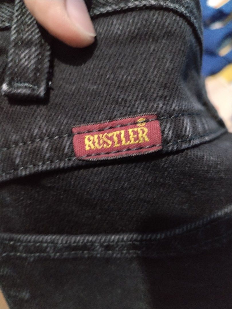 Rustler by Wrangler Black Jeans Size 38x30 (Category: Jeans) located in Manila. Submitted by solebrothers2826 (Listing ID 1470101157, Image 3). Description: - Brand: Rustler (by Wrangler) - Color: Solid black wash - Size: 38x30 - Material: 100% cotton - Origin: Made in Mexico - Features: Classic button closure, belt loops, and signature red and yellow brand label on the back waistband -price slightly negotiable.