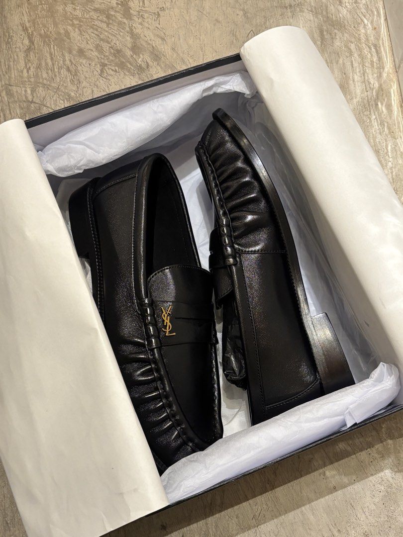 Saint Laurent Le Loafers (Category: Casual Shoes) located in Manila. Submitted by distinct_mnl (Listing ID 1470124823, Image 3). Description: - Signature Cassandre logo in bronze-toned metal. - Hand-stitched moc toes. - Finished in a solid colour. - Composition: calfskin, brass. .