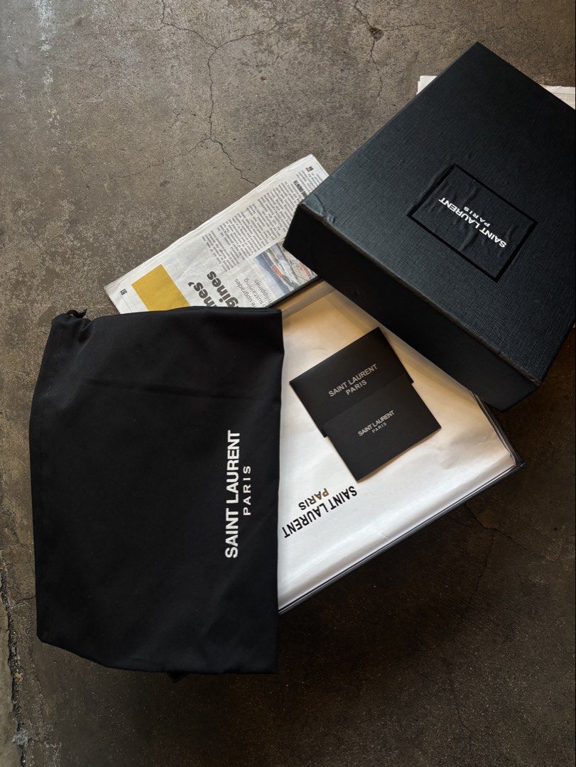 Saint Laurent Le Loafers (Category: Casual Shoes) located in Manila. Submitted by distinct_mnl (Listing ID 1470124823, Image 2). Description: - Signature Cassandre logo in bronze-toned metal. - Hand-stitched moc toes. - Finished in a solid colour. - Composition: calfskin, brass. .