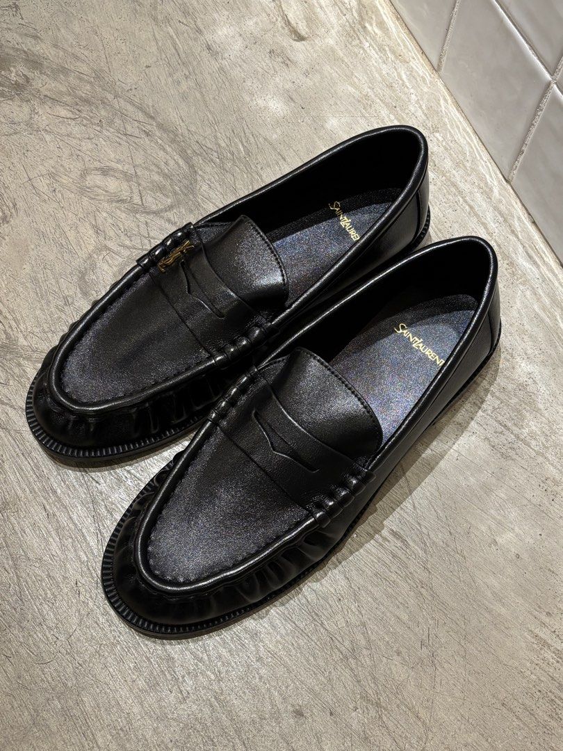 Saint Laurent Le Loafers (Category: Casual Shoes) located in Manila. Submitted by distinct_mnl (Listing ID 1470124823, Image 1). Description: - Signature Cassandre logo in bronze-toned metal. - Hand-stitched moc toes. - Finished in a solid colour. - Composition: calfskin, brass. .