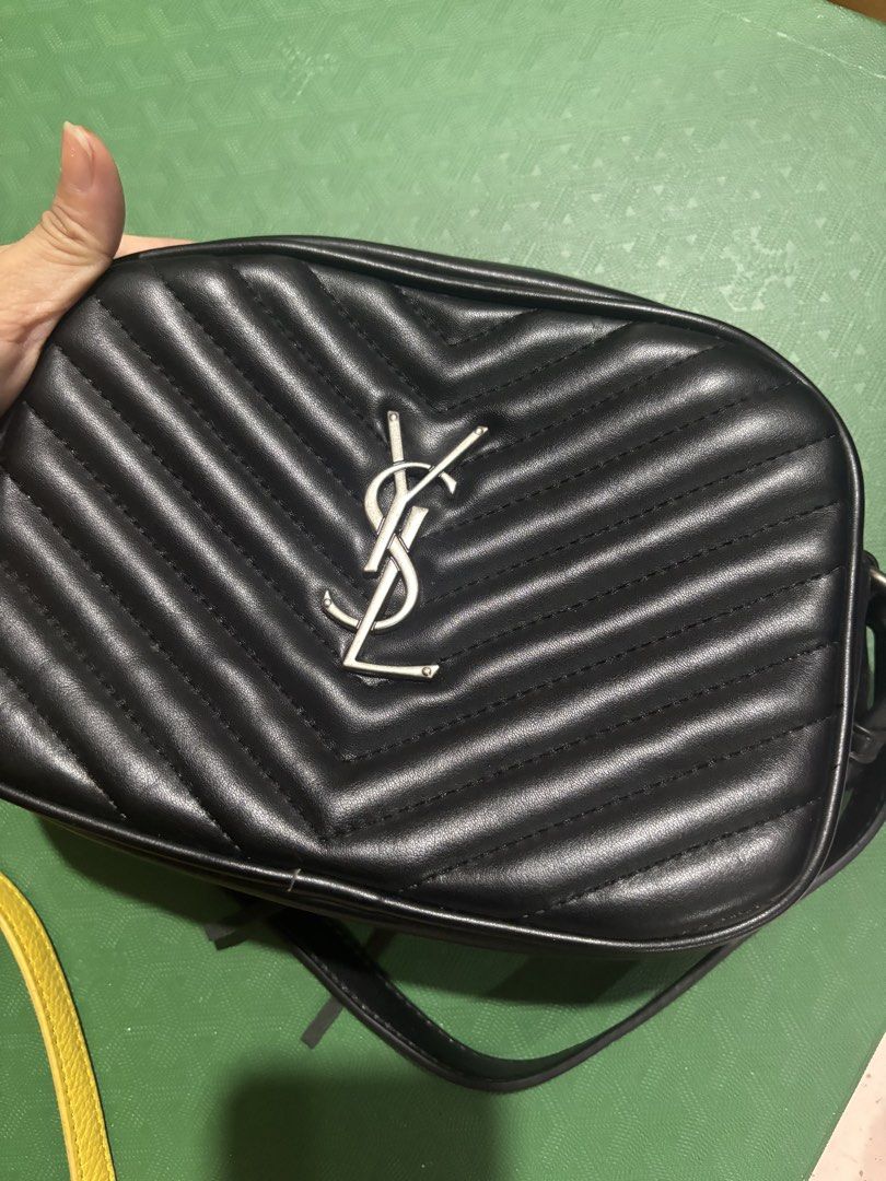 Saint Laurent Lou Camera Bag Black Silver Hardware (Category: Luxury Bags & Wallets) located in Rizal. Submitted by riri.rarapreloved (Listing ID 1469983677, Image 1). Description: Saint Laurent camera bag in black quilted leather - Iconic silver-tone interlocking YSL logo on the front - Elegant chevron stitching and clean structured design - Secure zip top closure - Dark interior lining equipped with a convenient slip pocket - Includes matching 