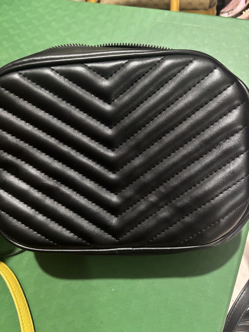 Saint Laurent Lou Camera Bag Black Silver Hardware (Category: Luxury Bags & Wallets) located in Rizal. Submitted by riri.rarapreloved (Listing ID 1469983677, Image 2). Description: Saint Laurent camera bag in black quilted leather - Iconic silver-tone interlocking YSL logo on the front - Elegant chevron stitching and clean structured design - Secure zip top closure - Dark interior lining equipped with a convenient slip pocket - Includes matching 