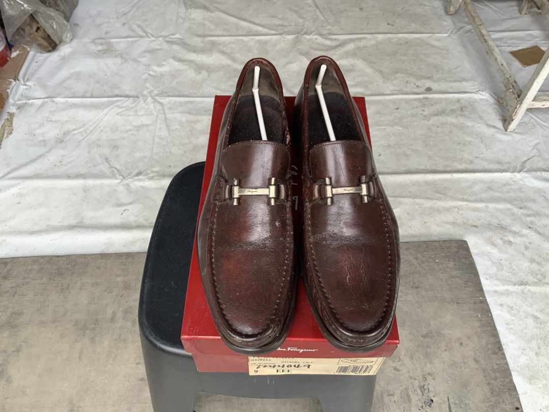 Salvatore Ferragamo Loafers (Category: Dress Shoes) located in Makati City. Submitted by imagineinc. (Listing ID 1469989131, Image 1). Description: - Salvatore Ferragamo - Model Tebaldo Loafers - Purchased in 2004 - Hickory calf leather in rich brown - Classic slip-on with silver-tone bit buckle - Stored for so long shows natural creasing of leather material - Original red Ferragamo shoe box.