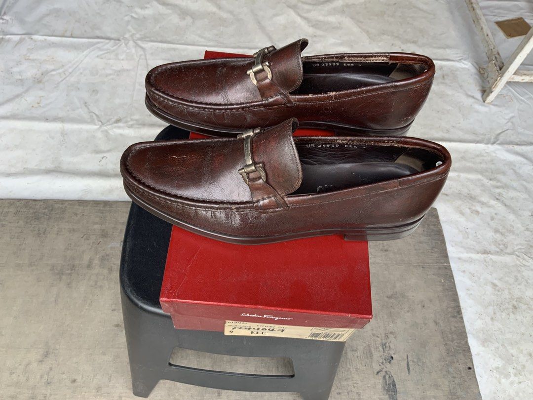 Salvatore Ferragamo Loafers (Category: Dress Shoes) located in Makati City. Submitted by imagineinc. (Listing ID 1469989131, Image 2). Description: - Salvatore Ferragamo - Model Tebaldo Loafers - Purchased in 2004 - Hickory calf leather in rich brown - Classic slip-on with silver-tone bit buckle - Stored for so long shows natural creasing of leather material - Original red Ferragamo shoe box.