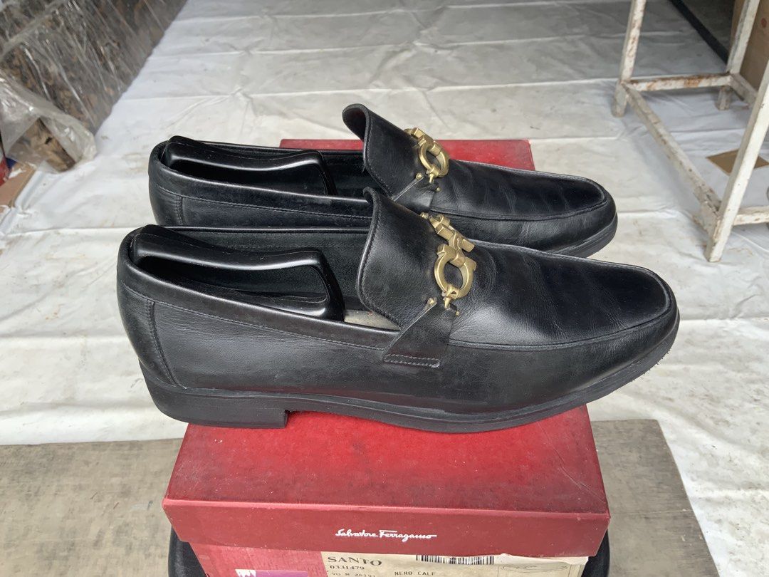 Salvatore Ferragamo Loafers (Category: Dress Shoes) located in Makati City. Submitted by imagineinc. (Listing ID 1469982158, Image 3). Description: - Salvatore Ferragamo Santo Loafers - Color: Black - Material: Premium calf leather - Size: 9 EEE fits size 10M - Iconic gold-tone Gancini buckle - Stored for so long, rubber sole started chipping. Sole replaced to textured rubber sole - Original red Ferragamo shoe box - Excellent pre-loved condition 