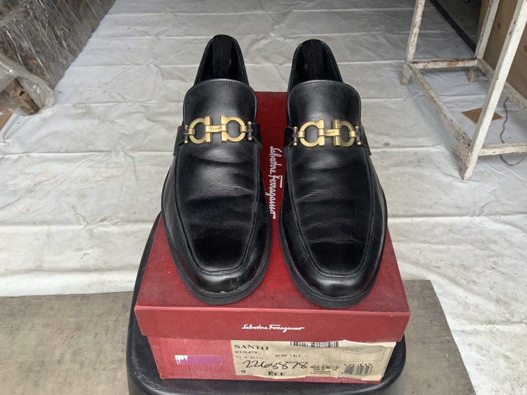 Salvatore Ferragamo Loafers (Category: Dress Shoes) located in Makati City. Submitted by imagineinc. (Listing ID 1469982158, Image 2). Description: - Salvatore Ferragamo Santo Loafers - Color: Black - Material: Premium calf leather - Size: 9 EEE fits size 10M - Iconic gold-tone Gancini buckle - Stored for so long, rubber sole started chipping. Sole replaced to textured rubber sole - Original red Ferragamo shoe box - Excellent pre-loved condition 