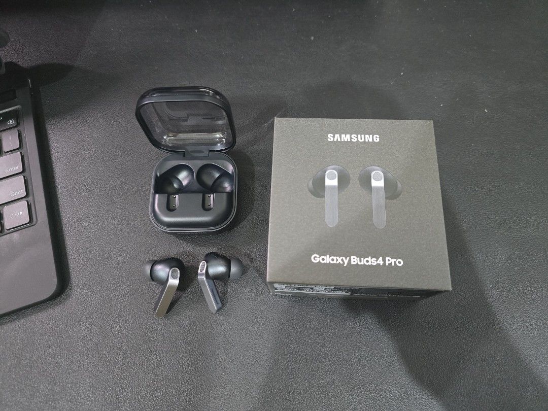 Samsung Galaxy Buds4 Pro wireless earbuds (Category: Earphones) located in Quezon City. Submitted by matteob (Listing ID 1470071612, Image 3). Description: Bought from samsung store August 2026 RFS: Need Cash. Samsung Galaxy Buds4 Pro wireless earbuds in black. Original retail box included. Charging case and earbuds displayed clearly. Clean finish with metallic accents on the stems..