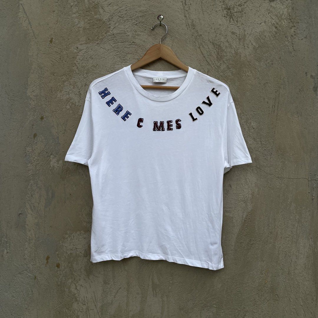 Sandro Paris HERE COMES LOVE (Category: Shirts) located in Cebu City. Submitted by jaydeeace (Listing ID 1470086076, Image 1). Description: Sandro Paris HERE COMES LOVE Size 1 19 x 24 Excellent condition Dm if Interested 📩.