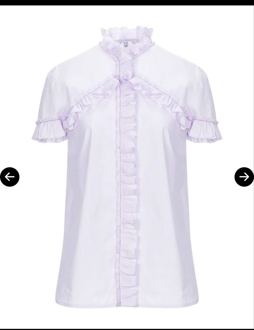 Sandro Paris Ruffled Short Sleeve Lavender Blouse (Category: Blouses) located in Quezon City. Submitted by bluefrenchorn (Listing ID 1470068280, Image 1). Description: - Brand: Sandro Paris - Color: Soft pastel lavender - Features: Ruffles along the front placket, collar, high neck, and short sleeves with a button-up front - Measurements: Pit-to-pit ~18.5 inches, Length ~23.5 inches - Condition: Gentle wear with a minor spot near the bottom hem -