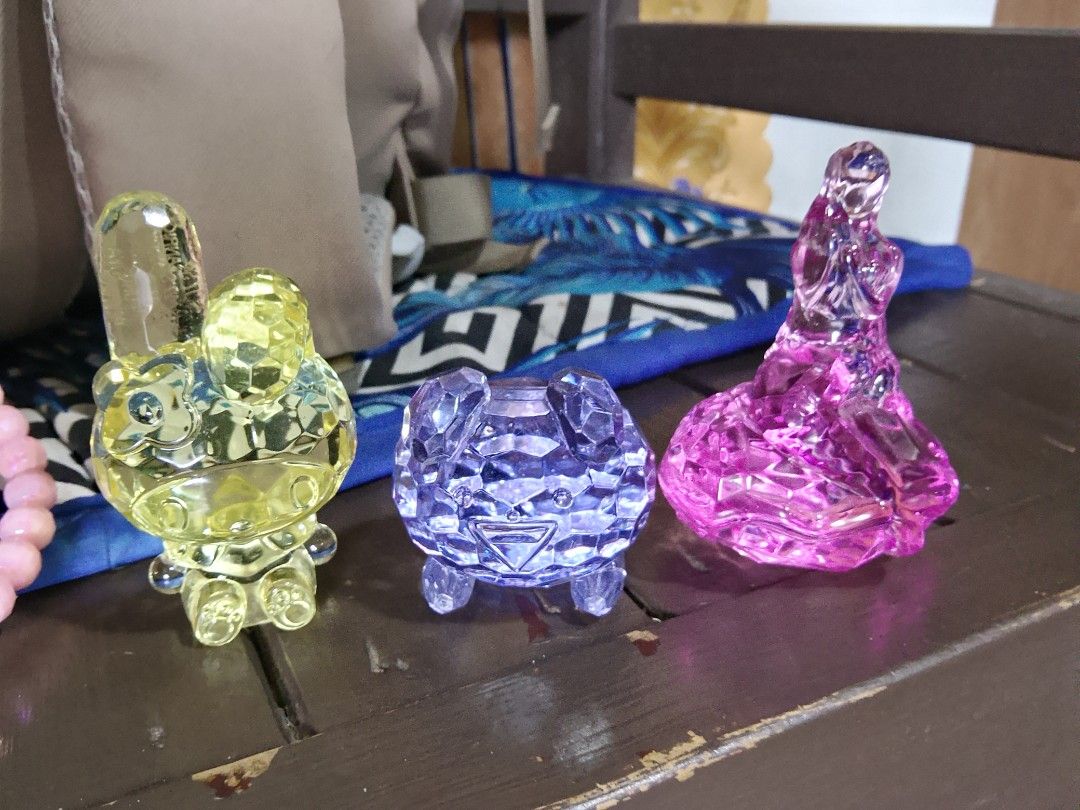 Sanrio Clear Crystal Acrylic Figurines Set (Category: Designer & Blind Box Toys) located in Abucay. Submitted by yanies_closet (Listing ID 1470082180, Image 1). Description: - Set of 3 faceted crystal acrylic character figurines - Includes yellow My Melody, purple frog, and pink figure in a dress - Catches the light beautifully when placed near a window - Perfect shelf decor and a must-have for Sanrio fans - Selling all three pieces together as a