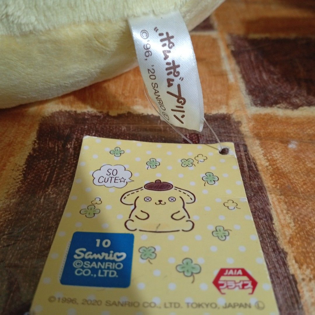 Sanrio Pompompurin eith macaroon (Category: Plushies & Soft Toys) located in Caloocan City. Submitted by thecanceri83884 (Listing ID 1469986255, Image 3). Description: - Official Sanrio - Features Pompompurin in his signature brown bere - Holding a small, fluffy white animal with a matching pink bow - Made with super soft, huggable plush material - Original cardboard hang tag still attached - Perfect addition for Sanrio and Pompompurin collectors
