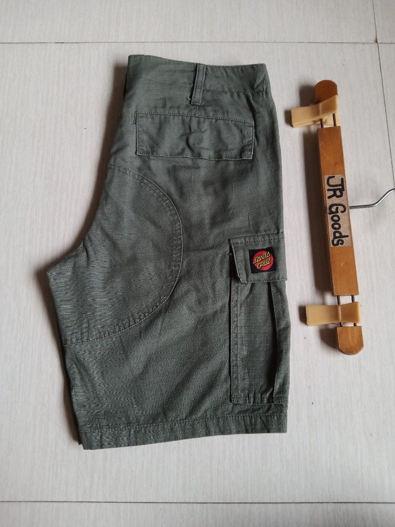 Santa Cruz Green Cargo Shorts (Category: Shorts) located in Tanay. Submitted by jrgoods (Listing ID 1469969349, Image 2). Description: SANTA CRUZ cargo short Size 28-29 Length 18 Good as new condition 680+ship Tanay Rizal location Shipping Nationwide - Material: Durable ripstop fabric - Features: Multiple utility pockets, branded waist button, and classic dot logo patch on the left leg - Style: Perfect for streetwear, daily wear, or skate session