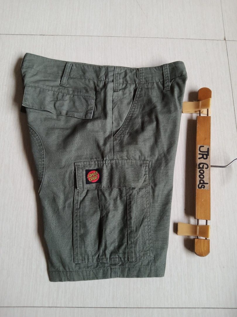 Santa Cruz Green Cargo Shorts (Category: Shorts) located in Tanay. Submitted by jrgoods (Listing ID 1469969349, Image 1). Description: SANTA CRUZ cargo short Size 28-29 Length 18 Good as new condition 680+ship Tanay Rizal location Shipping Nationwide - Material: Durable ripstop fabric - Features: Multiple utility pockets, branded waist button, and classic dot logo patch on the left leg - Style: Perfect for streetwear, daily wear, or skate session
