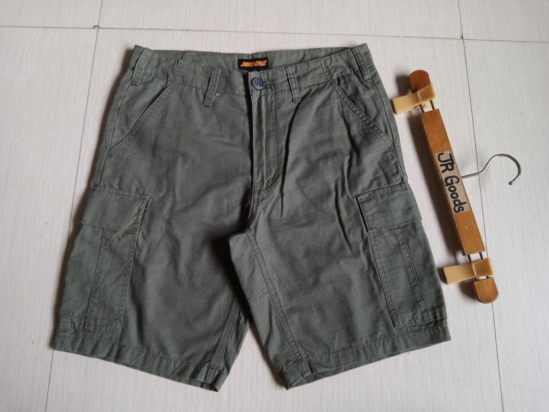 Santa Cruz Green Cargo Shorts (Category: Shorts) located in Tanay. Submitted by jrgoods (Listing ID 1469969349, Image 3). Description: SANTA CRUZ cargo short Size 28-29 Length 18 Good as new condition 680+ship Tanay Rizal location Shipping Nationwide - Material: Durable ripstop fabric - Features: Multiple utility pockets, branded waist button, and classic dot logo patch on the left leg - Style: Perfect for streetwear, daily wear, or skate session