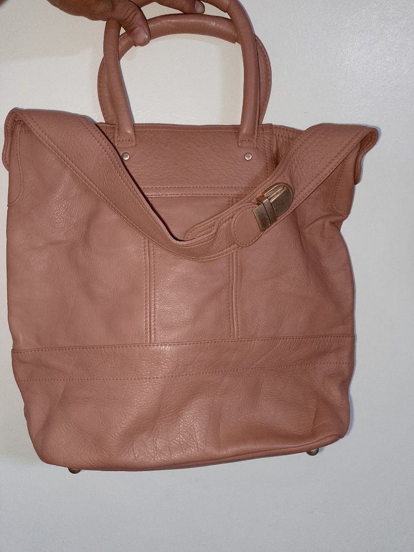 See by Chloe Pink Leather Tote Bag (Category: Luxury Bags & Wallets) located in Manila. Submitted by mjthrifted_second (Listing ID 1469984937, Image 2). Description: - Authentic See by Chloe pink leather tote bag - Elegant gold-tone hardware and gold embossed logo - Dual top handles plus a convenient shoulder strap - Two front zippered pockets with signature round pull tabs - Secure zip top closure with soft slouchy structure and base studs - Pat