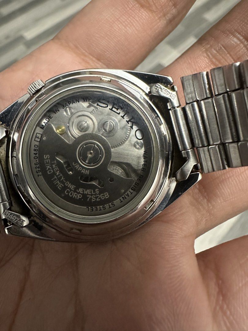 Seiko 5 Automatic 21 Jewels Silver Dial Watch (Category: Men's Watches) located in Caloocan City. Submitted by alexandre12 (Listing ID 1470106485, Image 2). Description: - Model: Seiko 7S26-0480 - Dial: Silver sunburst with silver hour markers and day/date window at 3 o'clock - Movement: Automatic movement with exhibition case back - Material: Stainless steel case and matching link bracelet - Condition: Normal wear marks from regular daily use.