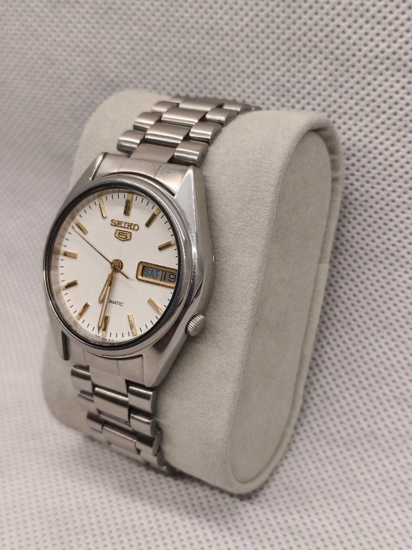 Seiko 5 Automatic reference 7009-876A (Category: Men's Watches) located in Pasig City. Submitted by timepiece-and-co (Listing ID 1469947650, Image 2). Description: Movement: Caliber 7009 automatic (17 jewels). Dial Features: White/silver sunburst dial, applied indices, and an inner bezel ring featuring a 13–24 military hour track. Complication: Day and date window located at the 3 o'clock position.
