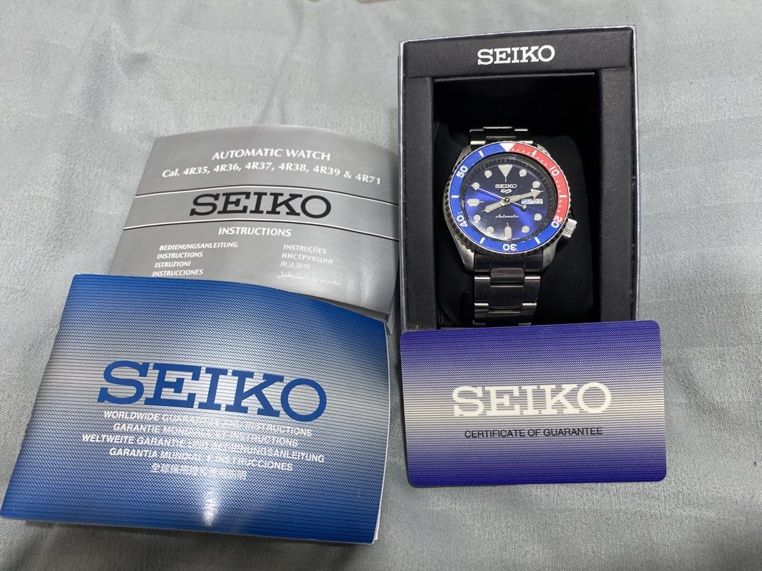 Seiko 5 Automatic Watch Pepsi Bezel with Box and Papers (Category: Men's Watches) located in Manila. Submitted by cyyruss (Listing ID 1470073129, Image 1). Description: - Brand: Seiko 5 Automatic Watch - Dial: Stunning blue sunburst with day-date window at 3 o'clock - Bezel: Red and blue bezel - Case & Bracelet: Polished steel case with steel bracelet - Condition: Clean crystal, well-maintained - Inclusions: Original presentation box, instruction