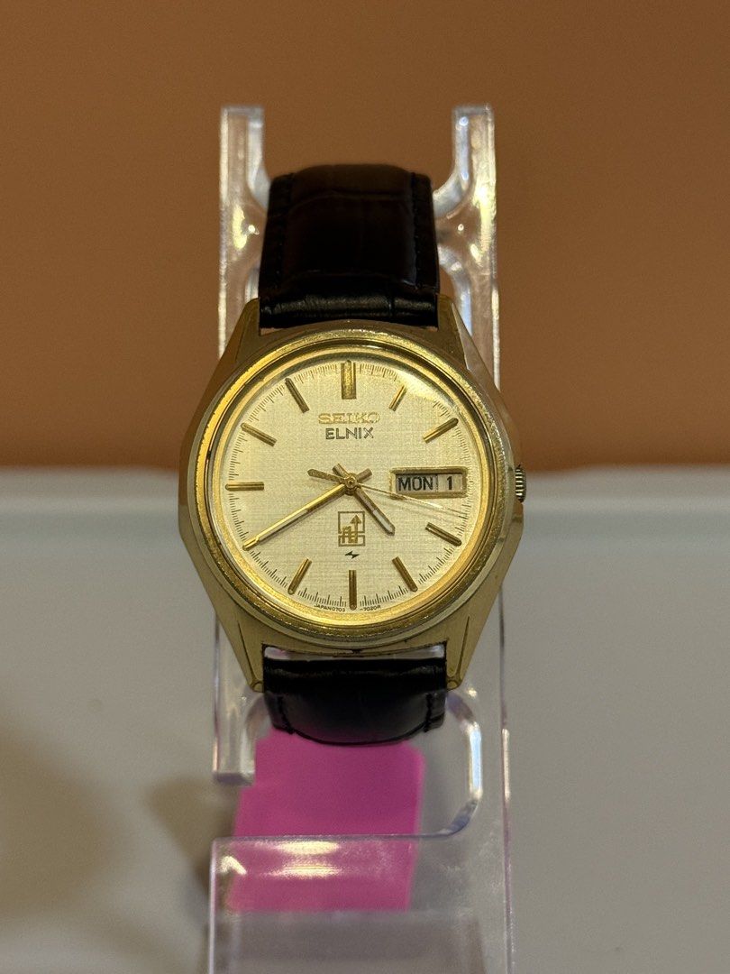 Seiko Elnix Gold Dial Watch (Category: Men's Watches) located in Bacoor. Submitted by michiepeachy (Listing ID 1470130529, Image 2). Description: Movement: electromechanical / transistorized balance Strap: Replaced Issue: None Price: 7,500 Inclusion: Watch only ‼️Please be reminded that this is preloved (second-hand), so it may have minor signs of wear consistent with its age. Kindly review the photos before purchasing.‼️.