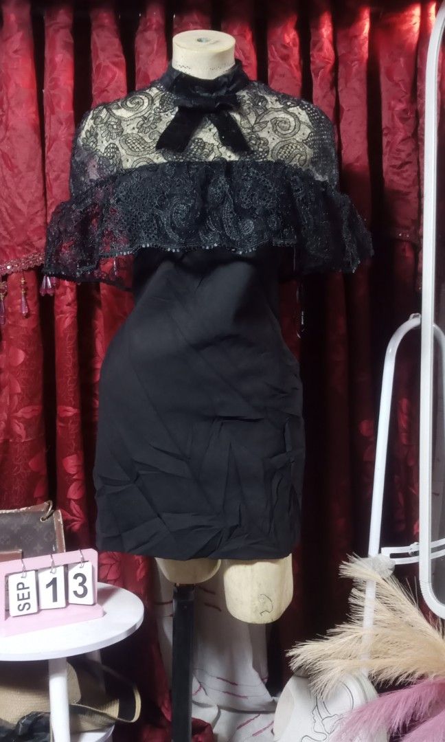 Self-portrait (Category: Dresses) located in Manila. Submitted by wheneity67thifted (Listing ID 1470136688, Image 2). Description: This garment is a black mini dress featuring a sheer lace yoke, a high mock neck, an attached ruffled lace capelet, and a velvet bow accent at the front..