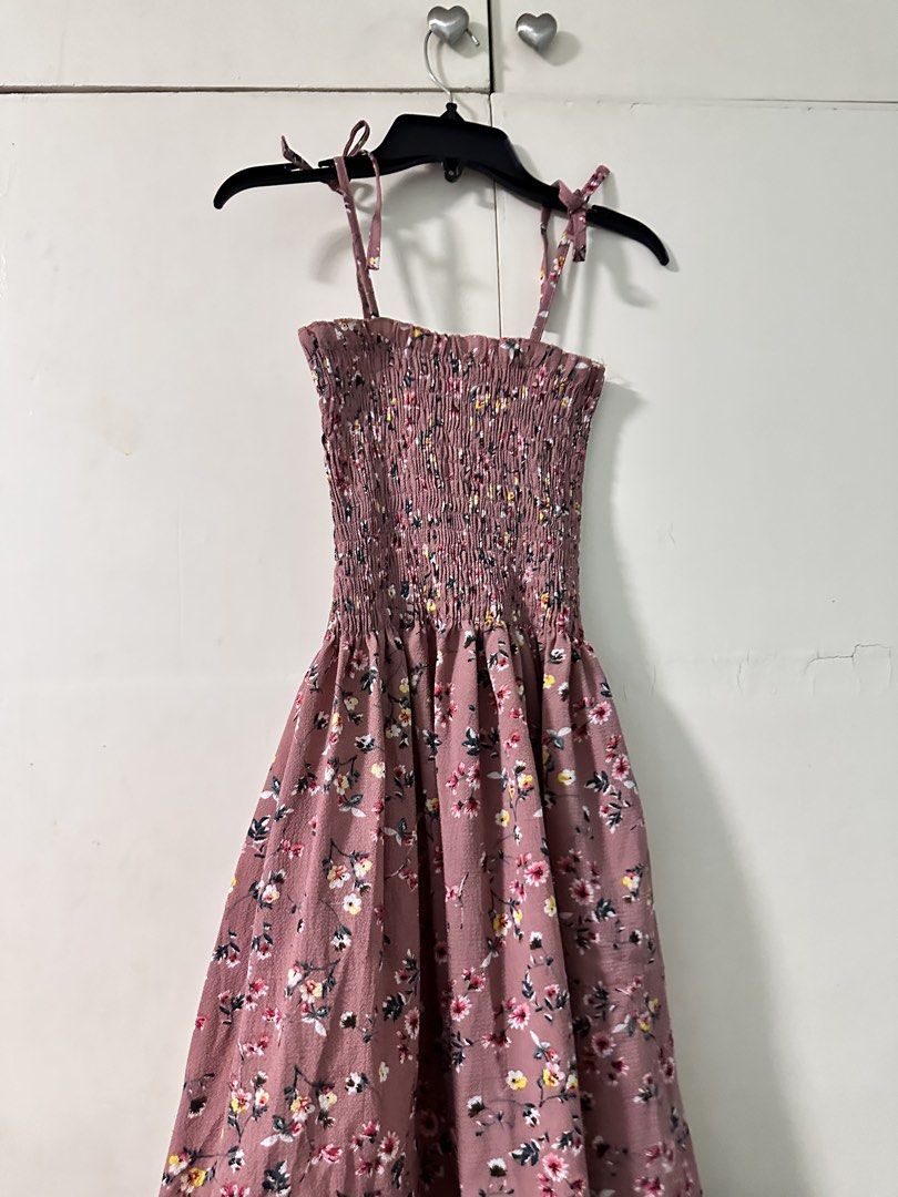 Self-Tie Summer Smocked Dress (Category: Dresses) located in Quezon City. Submitted by bentabelles (Listing ID 1470119760, Image 1). Description: - Dusty pink midi dress with a charming small floral print - Fully smocked bodice for a stretchy and comfortable fit - Adjustable self-tie straps at the shoulders - Flowy skirt that falls gracefully below the knee - Lightweight fabric, ideal for warm weather and casual days - Easy pullover style for qui