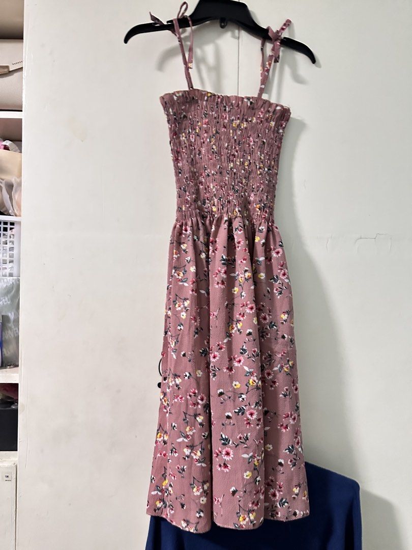 Self-Tie Summer Smocked Dress (Category: Dresses) located in Quezon City. Submitted by bentabelles (Listing ID 1470119760, Image 2). Description: - Dusty pink midi dress with a charming small floral print - Fully smocked bodice for a stretchy and comfortable fit - Adjustable self-tie straps at the shoulders - Flowy skirt that falls gracefully below the knee - Lightweight fabric, ideal for warm weather and casual days - Easy pullover style for qui