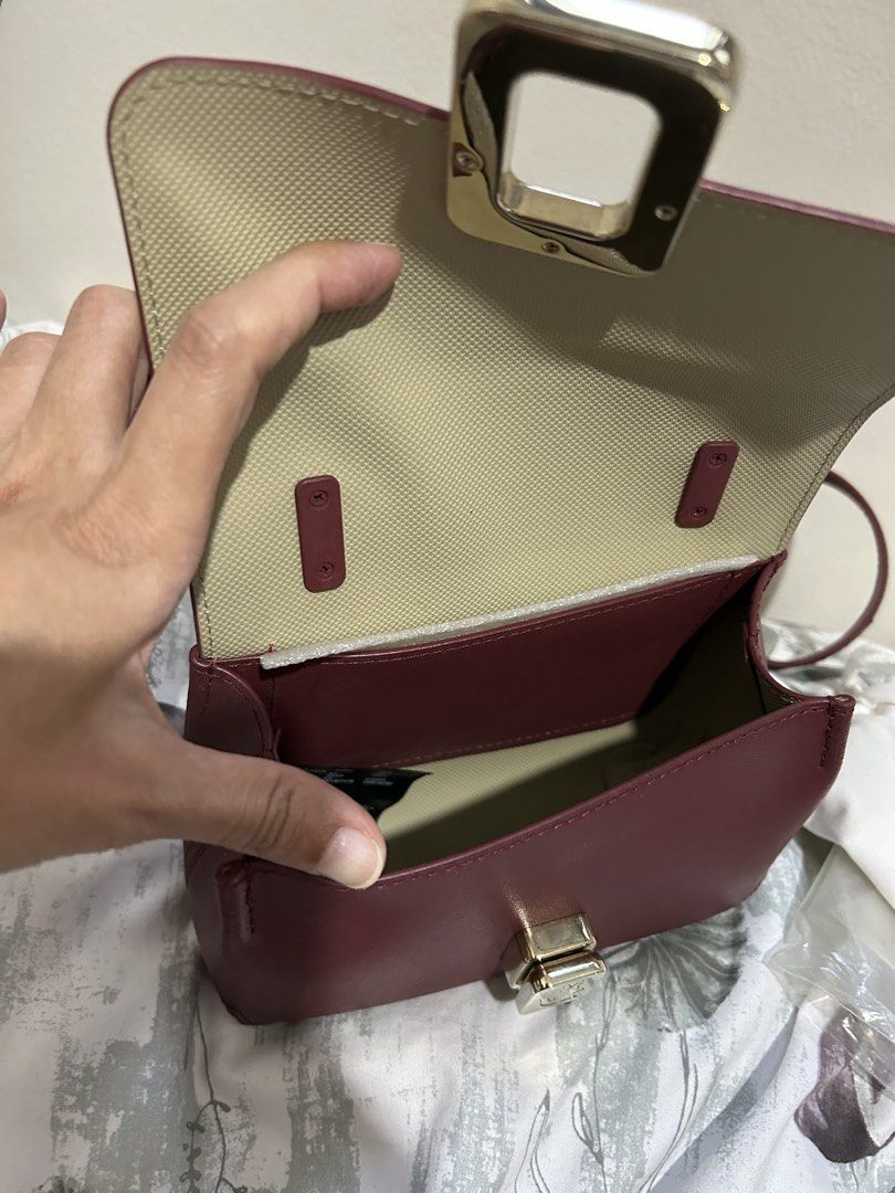 SELLING LOW: LACOSTE AMELIA (Category: Luxury Bags & Wallets) located in Quezon City. Submitted by dropshopselections (Listing ID 1470037186, Image 3). Description: original approx 8 x 5.6 x 3 inches unused with tag, dustbag, and plastic split cow leather.
