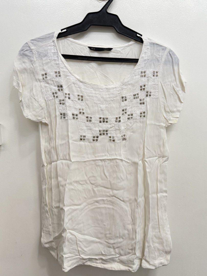 Sfera White Blouse Size M with Beaded Neckline (Category: Blouses) located in Quezon City. Submitted by reivia.vend (Listing ID 1469989572, Image 1). Description: - Brand: Sfera - Color: White - Size: EUR M, MEX 30 - Style: Short sleeve top with relaxed fit - Details: Scoop neckline with white embroidery and metallic beads - Material: Lightweight and breathable fabric - Condition: Excellent / Preloved (ready to wear).