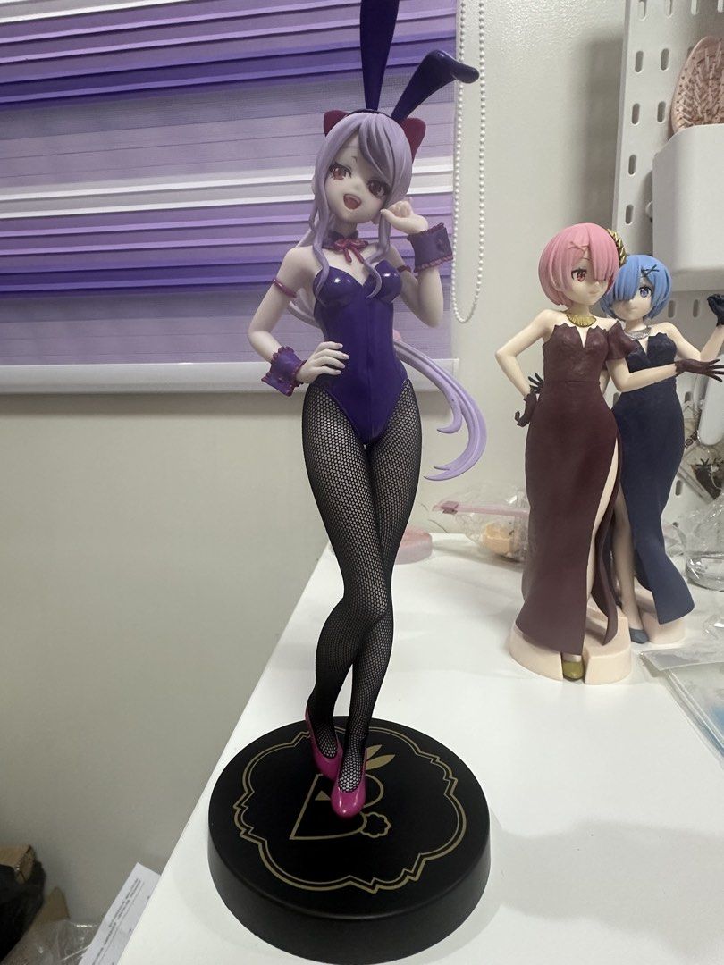 Shalltear overlord figure (Category: Figurines & Statues) located in Manila. Submitted by silentfire.54ea36 (Listing ID 1470115398, Image 1). Description: - Authentic purple bunny girl anime figure - Features long purple hair and cute bunny ears headband - Dressed in a dark purple leotard with real mesh fishnet tights and pink high heels - Stands securely on a black round base - Ideal for anime and figure collectors - Note: Background figures are