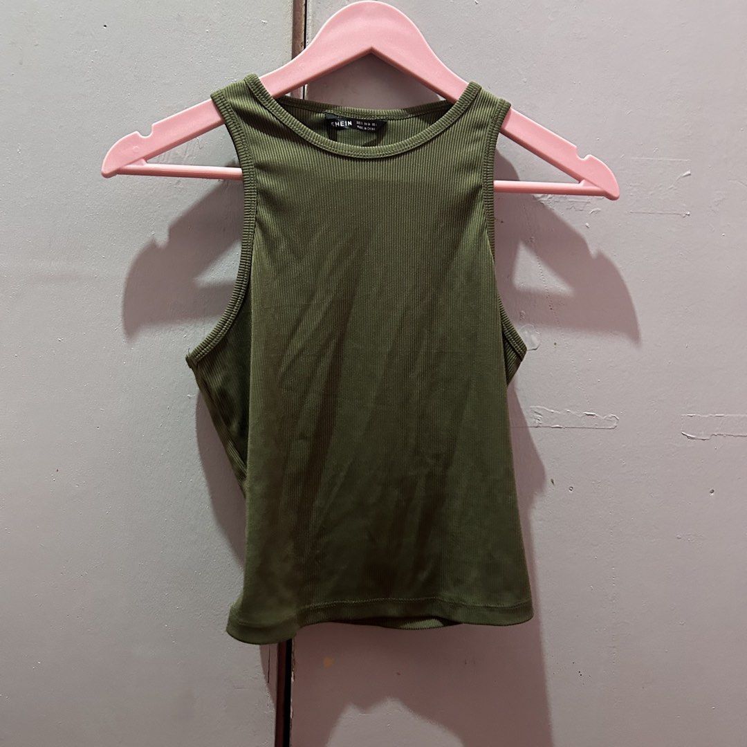 SHEIN Army Green Ribbed Tank Top (Category: Sleeveless) located in Mandaluyong City. Submitted by strawbyeries (Listing ID 1470080474, Image 1). Description: - Brand: SHEIN - Color: Army Green - Style: Racerback ribbed tank top - Material: Stretchy knit, super comfortable - Fit: True to size - Versatile basic, great for layering or pairing with high-waisted jeans.